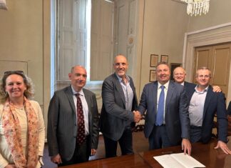 ITA Holding acquires Sipack; Sipack founder and Chief Executive Walter Pacioni (left), shakes hands with ITA Holding shareholder Mauro Celli
