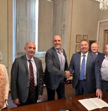 ITA Holding acquires Sipack; Sipack founder and Chief Executive Walter Pacioni (left), shakes hands with ITA Holding shareholder Mauro Celli