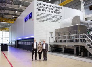 Aiming to drive a completely new, scalable decarbonisation process across the global paper industry: (L-r) Jonas Bergström, Elena Viviani, and Matthias Höhsl in front of the pilot installation at Voith in Heidenheim, Germany