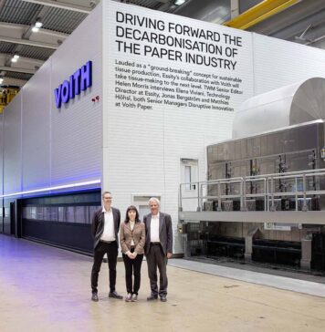 Aiming to drive a completely new, scalable decarbonisation process across the global paper industry: (L-r) Jonas Bergström, Elena Viviani, and Matthias Höhsl in front of the pilot installation at Voith in Heidenheim, Germany