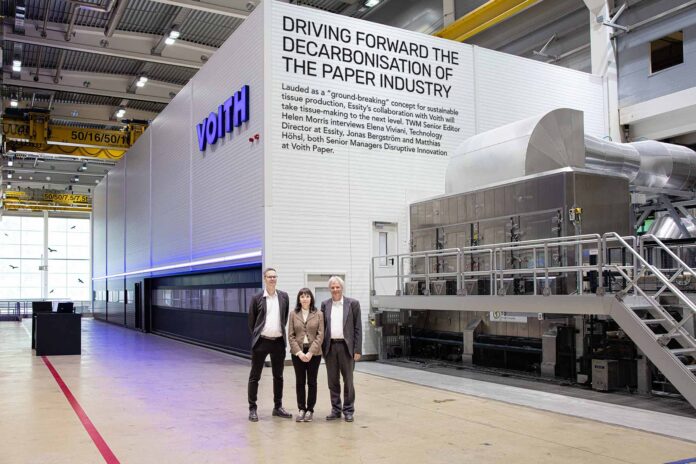 Aiming to drive a completely new, scalable decarbonisation process across the global paper industry: (L-r) Jonas Bergström, Elena Viviani, and Matthias Höhsl in front of the pilot installation at Voith in Heidenheim, Germany